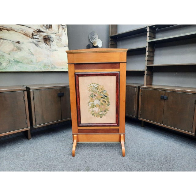 A beautiful vintage fire screen or stove screen. Produced circa 1880–1900. Made of cherry wood. The central panel is...