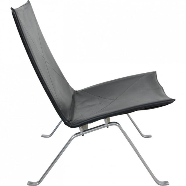 Poul kjærholm pk-22 lounge chair in original black leather from e. Kold christensen. The chair is from 1970 and appears...