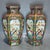 This magnificent pair of hexagonal porcelain vases showcases the intricate beauty of Famille Rose (Fencai) enamel...