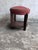 A charming French Art Deco stool dating from around 1930, combining a sculptural dark-stained wooden frame with a...