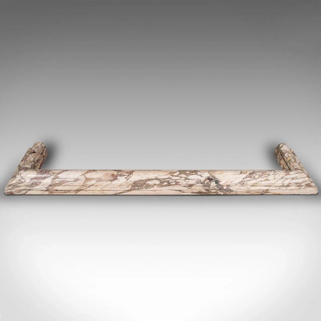 This is a grand antique fireplace surround. An English, Calacatta Violetta marble country house fire kerb, dating to the...