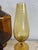 This is a collection of Italian Empoli Rossi glass. This glass collection has three covered jars with two vases. This...