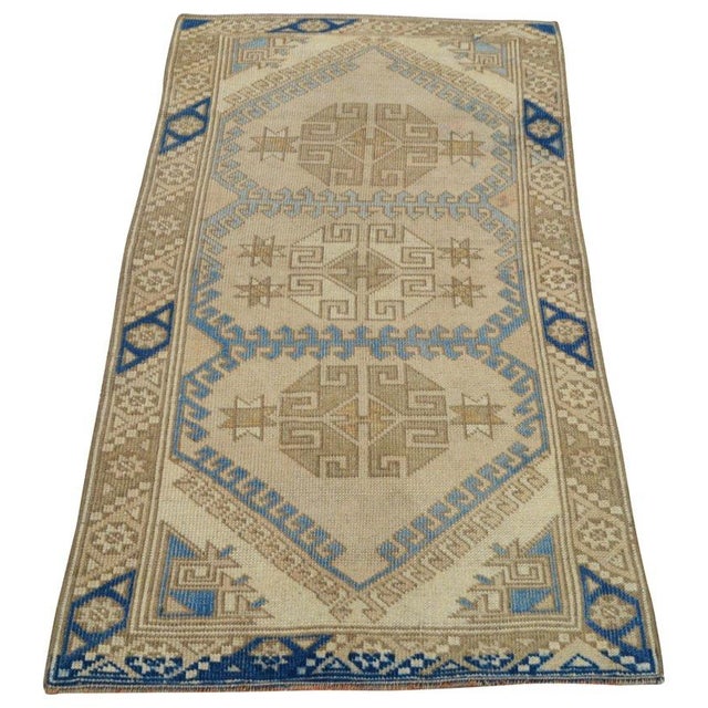 Hand-knotted with care using traditional rug-making techniques, this wool rug blends timeless craftsmanship with a modern...