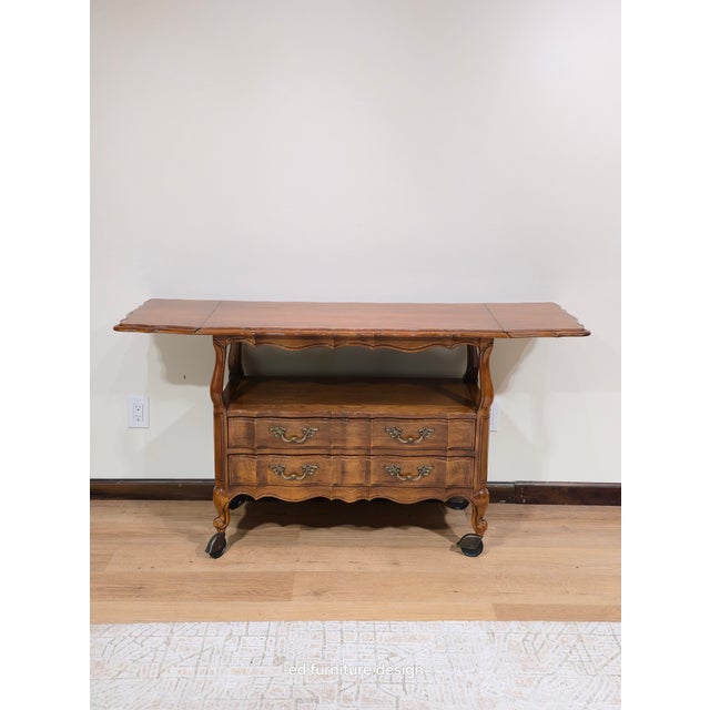 A beautiful French Provincial Louis XV style drop leaf buffet server or bar cabinet By Thomasville USA, Circa 1970s Carved...