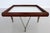Gorgeous particular low sofa table from the Italian mid-century, approx. 1960s. The mahogany veneer table frame is based...