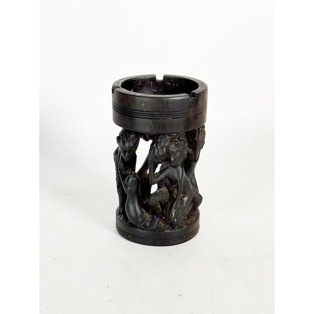 A French ashtray from the 1950s, crafted from carved wood and designed as a small decorative sculpture. The circular upper...