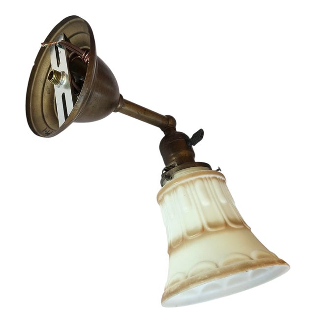 This is such a great sconce with simple embossed scalloped pattern and fabulous carmel accent. Powder, bar, kitchen, just...