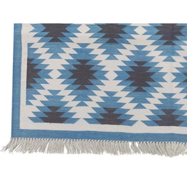 Made from naturally dyed 100% cotton yarn, these dhurrie rugs have been handwoven by skilled craftsmen in Jaipur. The age...