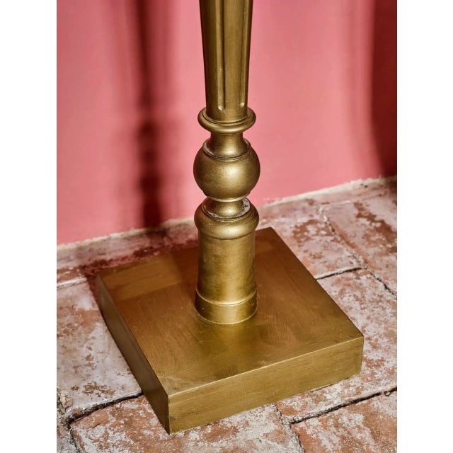 Pedestal with marble top, designed for presenting a statue, bust or decorative object. The solid wooden leg is decorated...