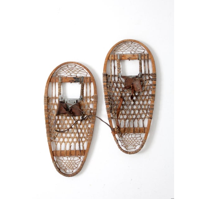 This authentic 1945 pair of Griswold U.S. military snowshoes adds a classic alpine lodge aesthetic to any interior....