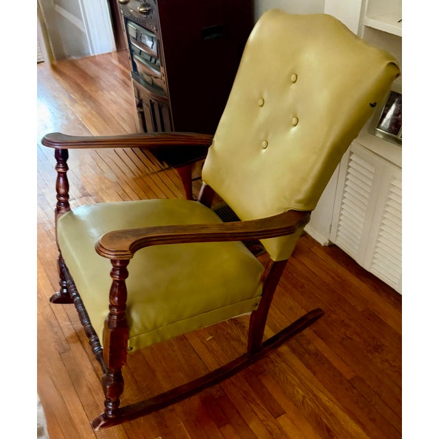 The classic aesthetic of this vintage rocking chair brings a nostalgic, traditional feel to any interior living space. Its...