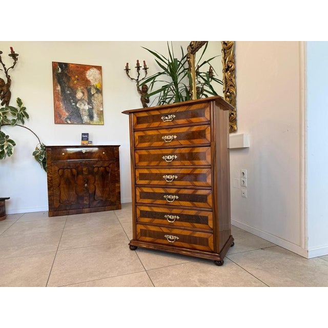 Restored Gründerzeit (late 19th-century) 7-drawer chest. Dimensions: Height x Width x Depth 114 x 82 x 46 cm. For sale is...