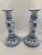An elegant pair of glazed ceramic Blue and White hand painted French Style Candlestick Holders. Circa 1990s. No markings....