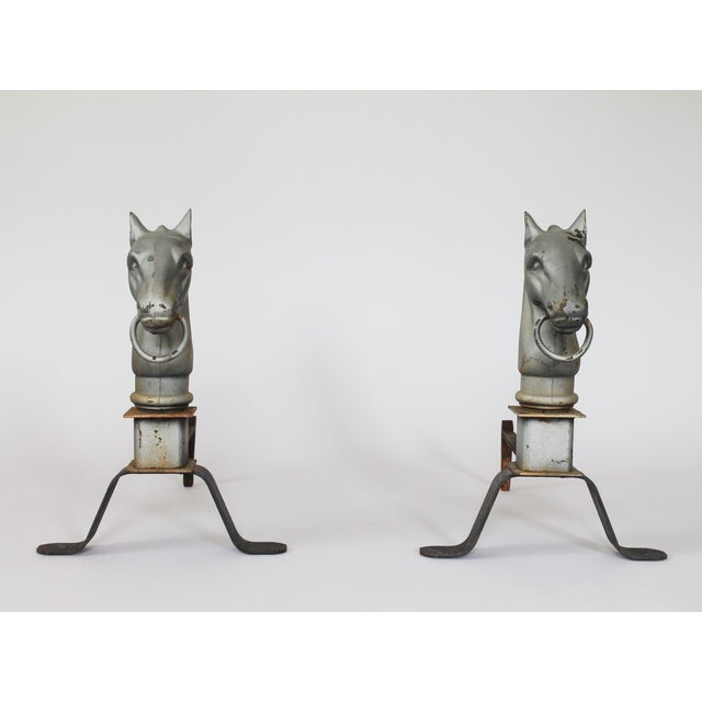 Pair of vintage horse head andirons. Made of cast iron, featuring decorative equestrian busts. No makes mark. Condition,...