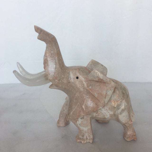Adorable hand carved pink marble elephant with frosted acrylic tusks. It's slightly abstract while still being realistic...