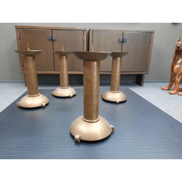 Four charming candlesticks in the Art Deco style. Material: Handmade from brass. Unsigned. Good and authentic original...