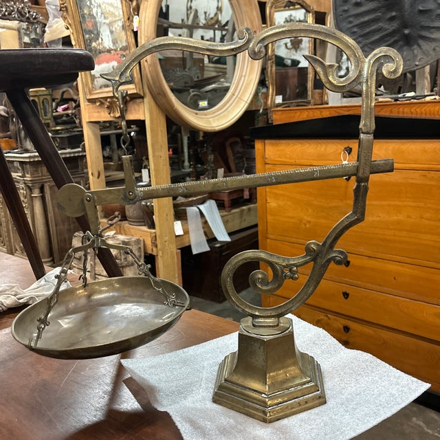 An antique brass balance scale from the early 20th century, Italy. This fabulous scale has a mark of "MDXL" or 1540 at the...