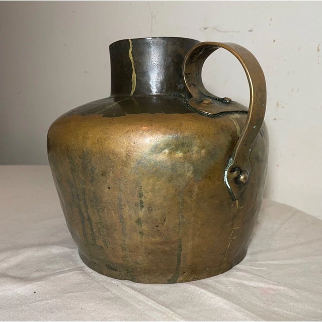Crafted with meticulous attention to detail, this rare early 19th century copper jug is a testament to the skill and...