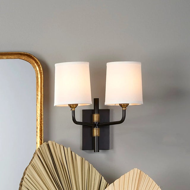 Traditional wall sconces are upgraded and elevated in the Lawton collection from Jamie Young. She adds the strength of...