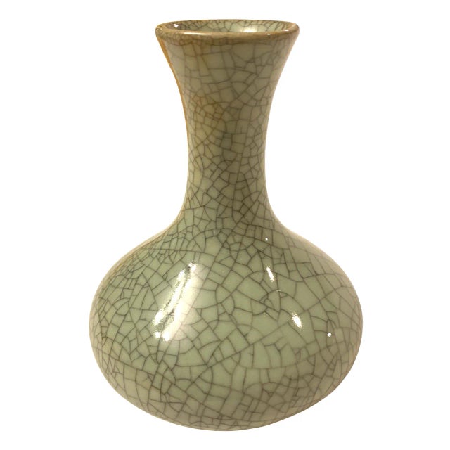 This elegant vintage Chinese vase showcases a beautiful celadon crackle glaze finish, celebrated for its intricate web of...