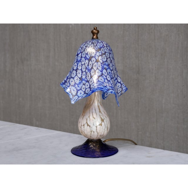 This bijou murano table lamp was produced in italy in the 1970s and showcases exceptional venetian glass craftsmanship....