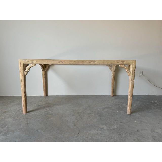 Whimsical Vintage Hollywood Regency style hand-carved faux bois cerused rectangular dining table base. The frame has...