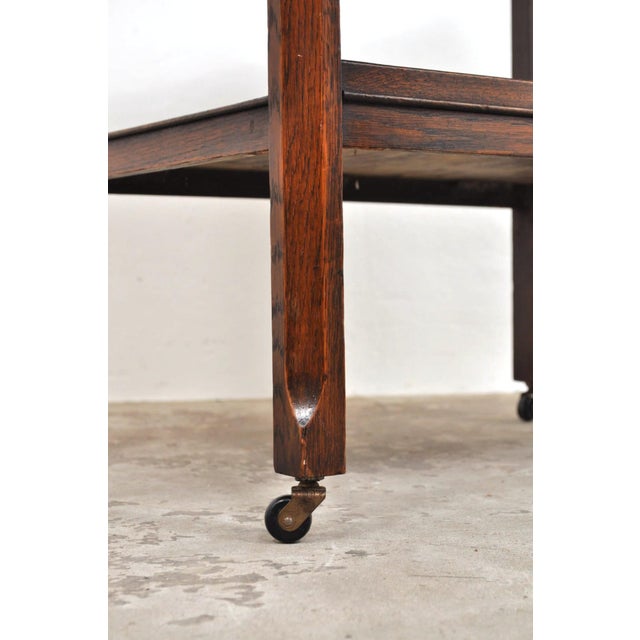 Antique serving trolley Beautiful oak trolley from the 1920s on four swivel wheels and a large drawer. Can you already...