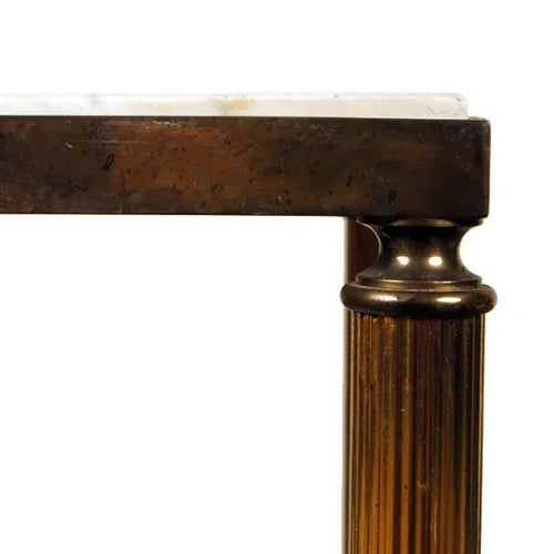A Neoclassical Brass Accent table sourced in France. This piece has a great patina both on the brass base and the original...