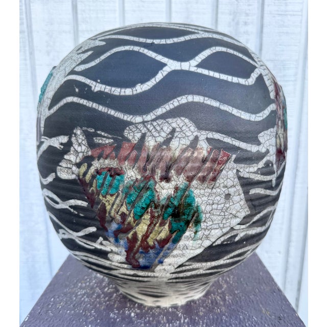 This charming and collectible piece reflects the unique style and craftsmanship of mid-20th-century ceramic art. Signed on...