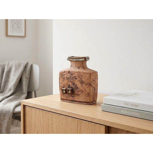 Expressive Scandinavian studio ceramics with a distinctive, coarsely textured surface. The rectangular body with its...