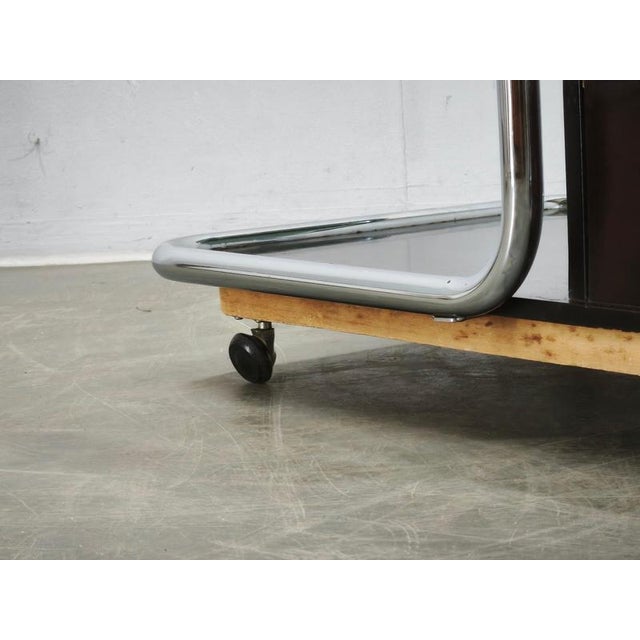 Rare 1970s Modernist bar cart from Czechoslovakia, distinguished by an expressive combination of chrome-plated tubular...