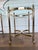 Striking pair of vintage brass and glass end tables in the style of LaBarge, showcasing an elegant neoclassical silhouette...