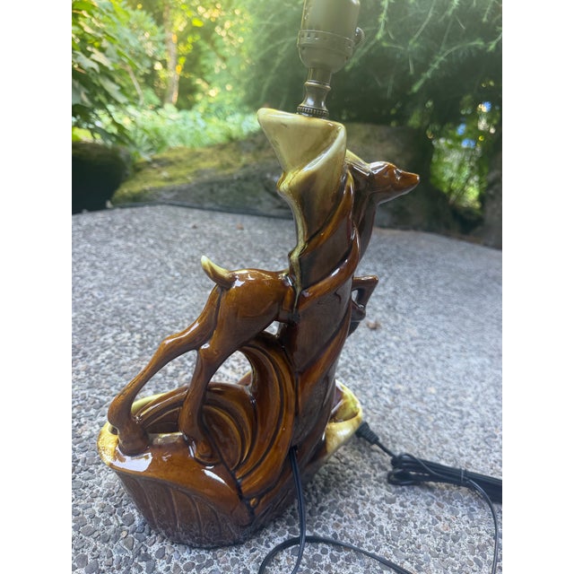 This product is a rare vintage 1950s medium-sized ceramic lamp and planter by the brand Phil Mar. The item features a...