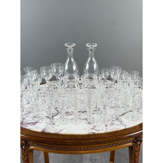 A beautiful 43-piece baccarat crystal set, comprising two decanters and various drinking glasses. an elegant and refined...