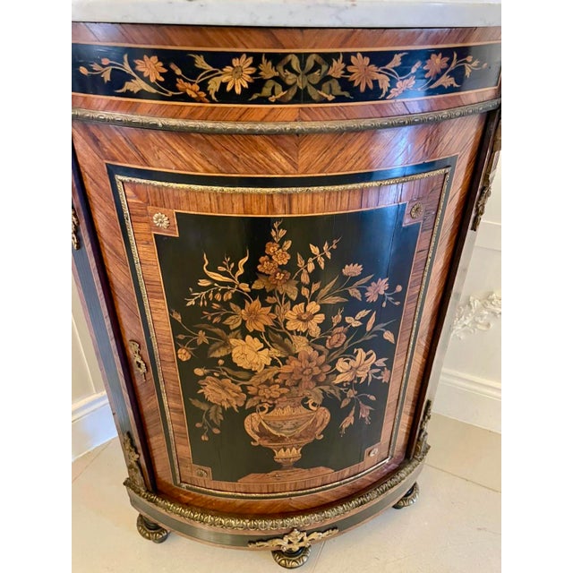 A fine quality 19th-century french louis xvi style corner cabinet beautifully inlaid and mounted with gilt-bronze ormolu....