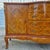 This is an elegant Louis XVI style sideboard cabinet with marble top and faux marquetry. The sideboard measures 59.5”...