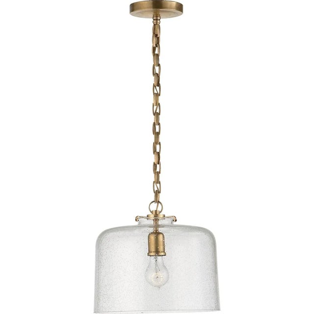Katie Dome Pendant in Hand-Rubbed Antique Brass with Seeded Glass Designer: Thomas O'Brien Canopy: 5.25" Round Mounting:...