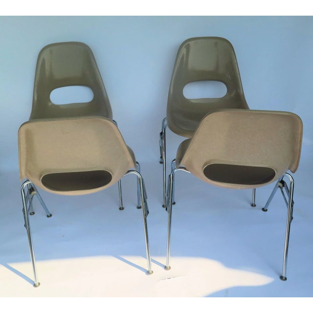 These chairs are a deep creamy beige. Produced in the material Ray and Charles Eames originally chose for their original...