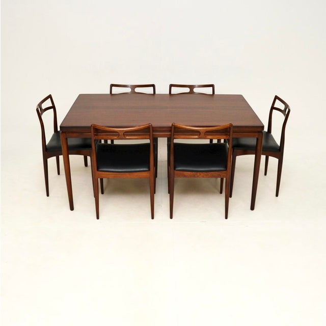A stunning Danish vintage dining table and chairs by Johannes Andersen for Christian Linneberg. These were made in...