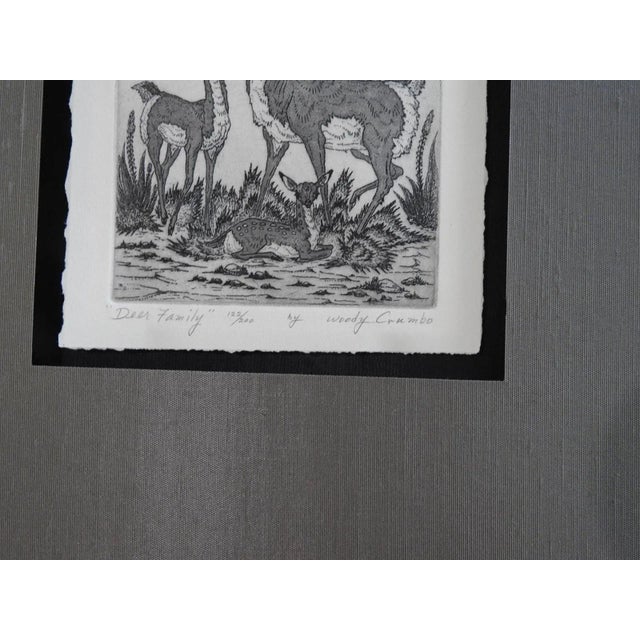 Mid 20th century etching on paper by Woody Crumbo (1919-1989) Potawatomi Tribe, Oklahoma. Signed, titled Deer Family and...