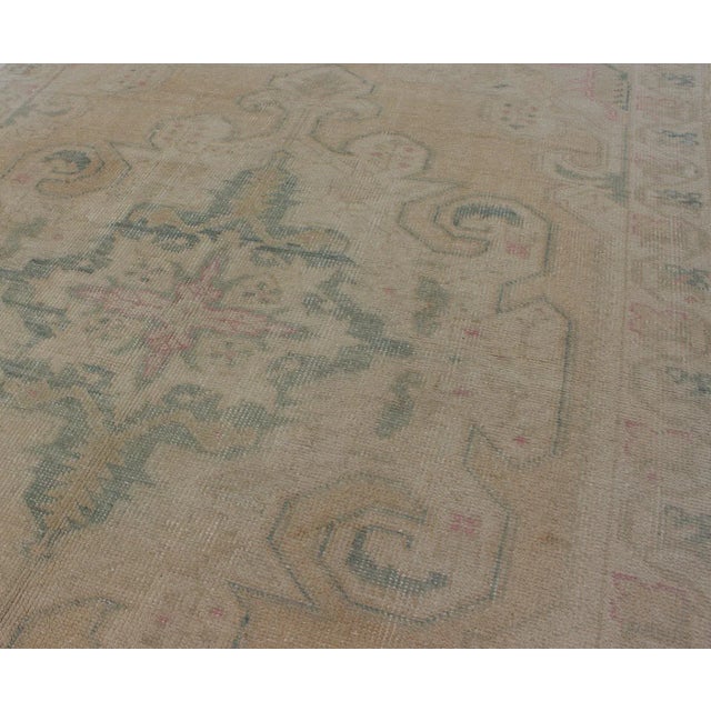 Vintage Oushak Rug From Turkey With Muted Colors and Floral Medallion For Sale - Image 10 of 11