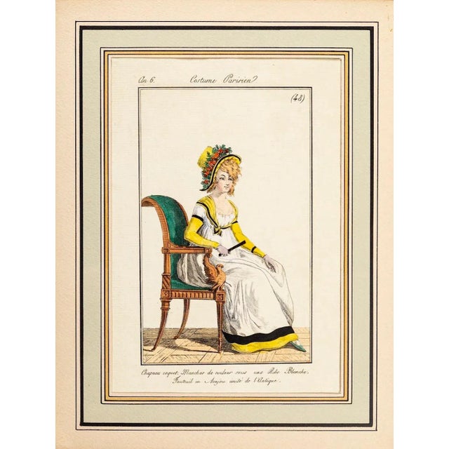 Image dimensions: 16 x 10.5 cm. Costume Parisien - Model n. 48 is an original watercolored print realized in 1797. The...