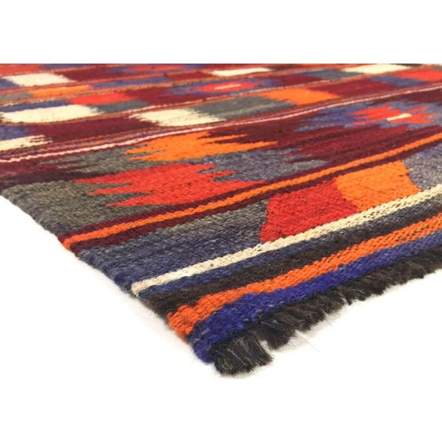 Expertly crafted in the Oushak region of Turkey, the Vintage Turkish Kilim is constructed with hand-woven wool on a wool...
