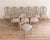 An elegant set of ten French chairs crafted in the Louis XV–Louis XVI transition style, dating to the twentieth century....