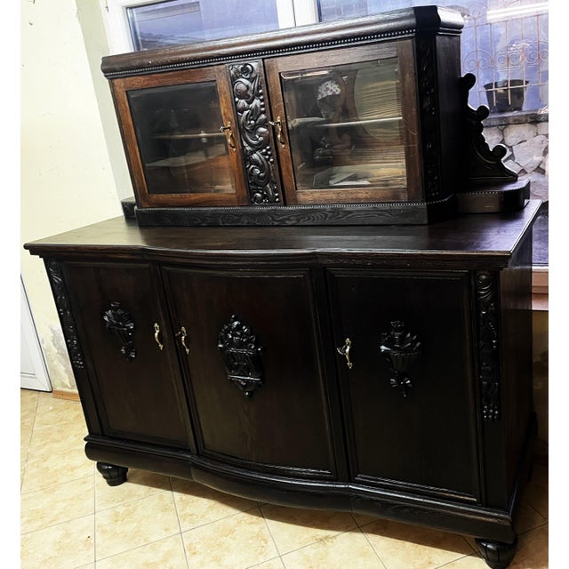 An impressive, highly decorative sideboard crafted in a European historicist style that blends distinct Neo-Renaissance...