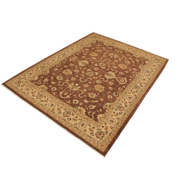 A Persian influenced Turkish hand knotted rug made by skilled artisans capable of creating the most exceptional vegetable...