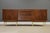 A mid century modern walnut dresser designed by Merton Gershun for American of Martinsville with louvered drawers and...