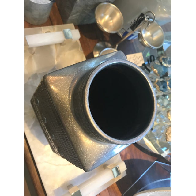 Cyan Designs antiqued silver metal Dhaka Vase. This vase is great on its own or paired with botanicals. We have a larger...