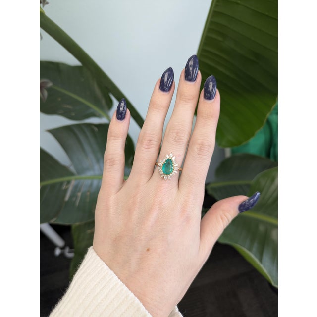 Stunning 1.7cts Colombian emerald ring set with natural diamonds in solid 14k gold. Features a 12x7mm pear-shaped emerald...