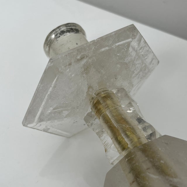 : Superb candle holder composed of rock crystal elements assembled around a gilded brass barrel. Dimensions: Height: 21.5...